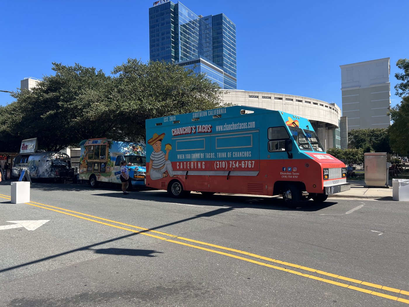 Food trucks lined up along a closed Uptown Charlotte street